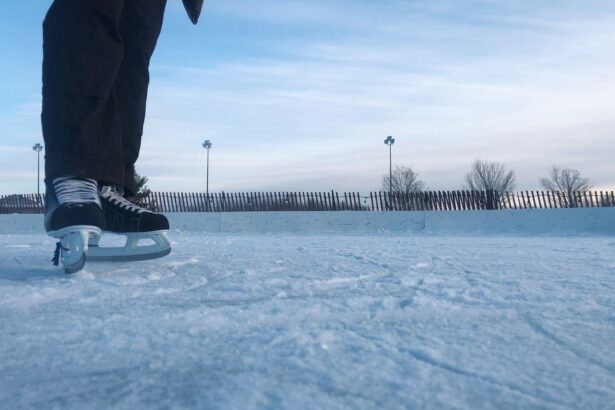 person in black pants and black shoes standing on snow covered ground during daytime