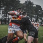 photography of men playing football during daytime